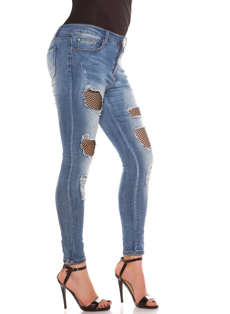 Sexy Curvy Girl Plus size ripped Skinny jeans with Black net inserts.